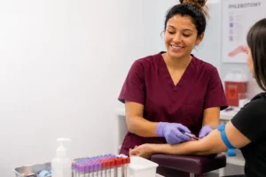 Phlebotomist collecting a blood sample from a patient